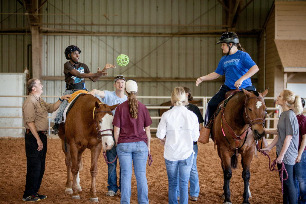 Kids playing on horseback